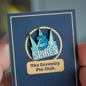 Three Spires pin badge