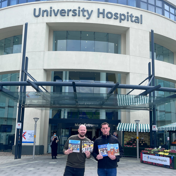 A book donation to UHCW Charity thanks to donation from local business and author